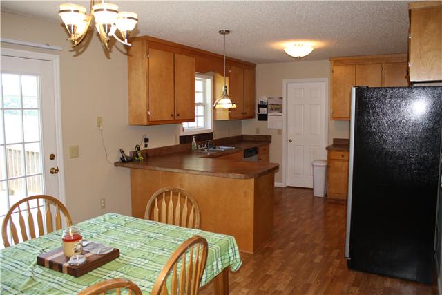 880 Barnette Road Minor Hill, TN 38473 - Photo 8 of 19 Kitchen w/ Breakfast bar, stainless appliances.