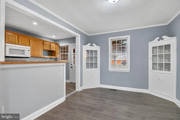 a kitchen with stainless steel appliances granite countertop a refrigerator and cabinets