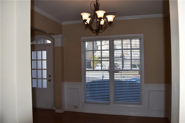 a view of a balcony and chandelier fan
