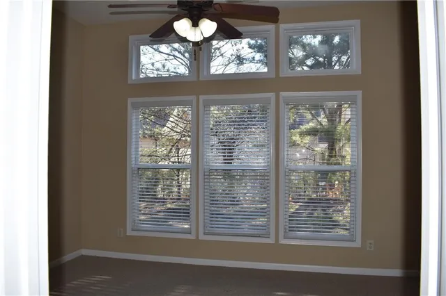 a view of a livingroom with windows