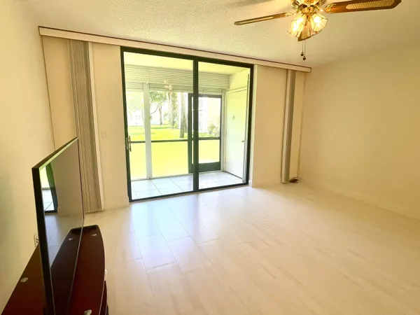 a view of an empty room with a window