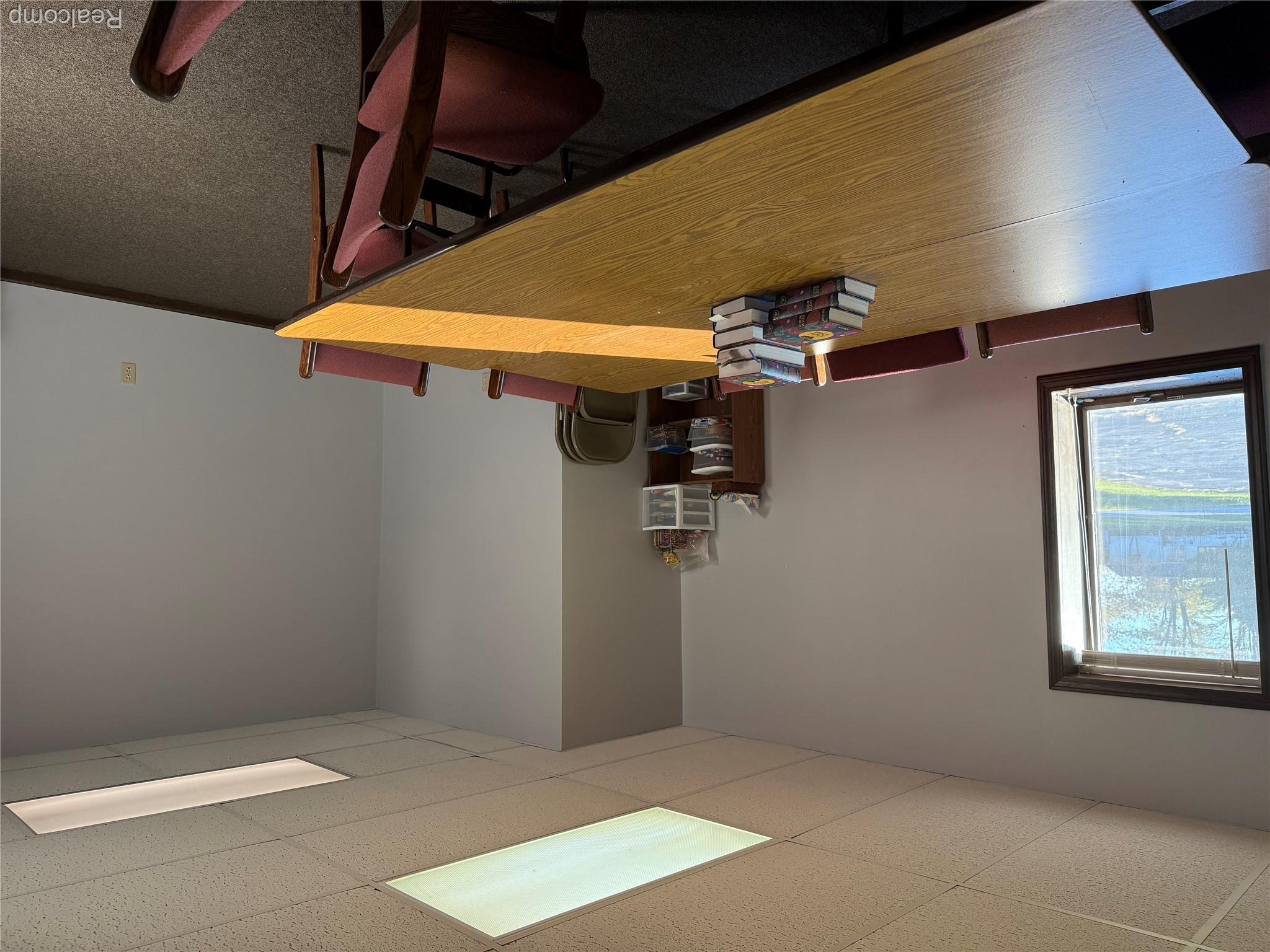 2450 West Snover Road Sandusky, MI 48471 - Photo 21 of 30 Carpeted dining space featuring a drop ceiling