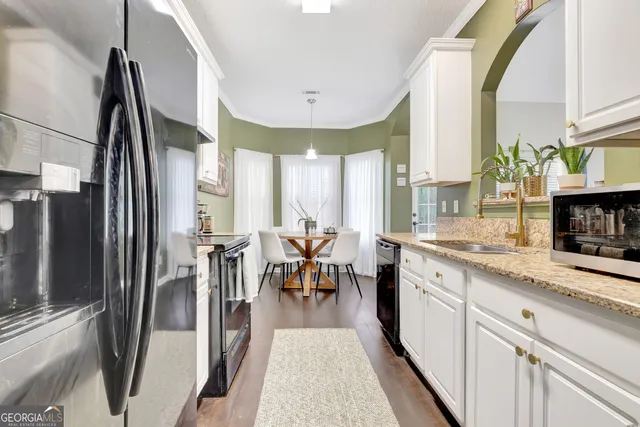 a very nice looking dining room with a large window