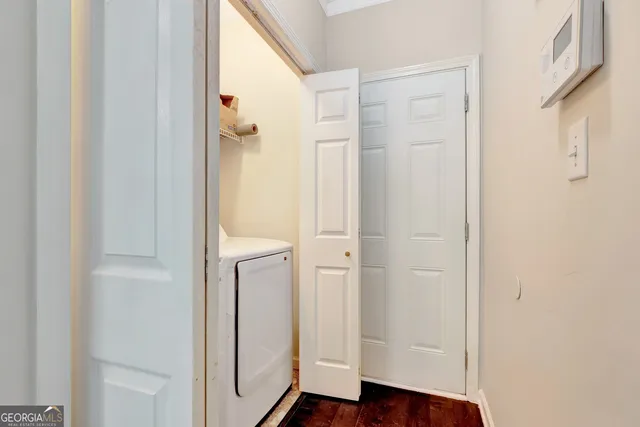 a view of front door with wooden floor