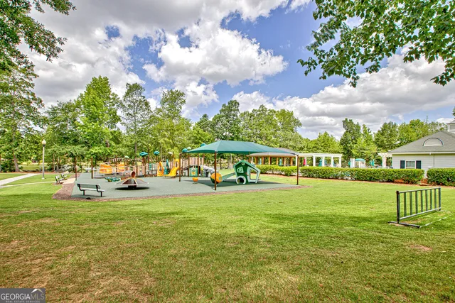 a view of a park with large trees and a big yard