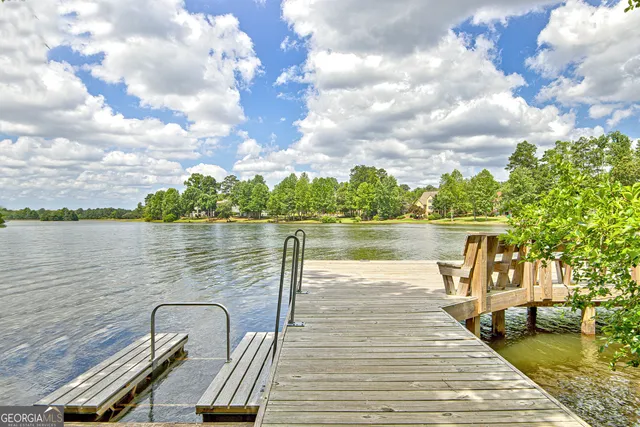 an aerial view of a house with a yard fountain and outdoor seating