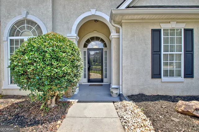 a view of entrance gate of a house