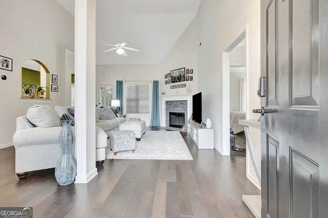 a living room with furniture and a fireplace
