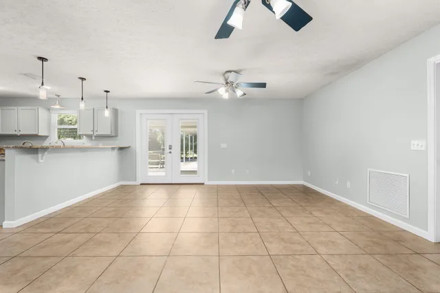 a kitchen with stainless steel appliances a refrigerator sink and cabinets