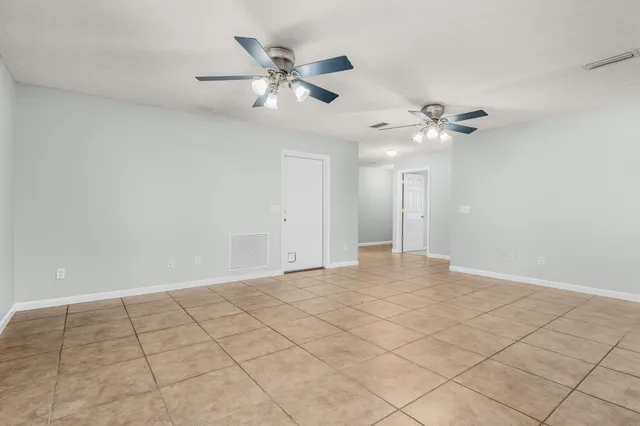 a kitchen with kitchen island granite countertop cabinets and stainless steel appliances
