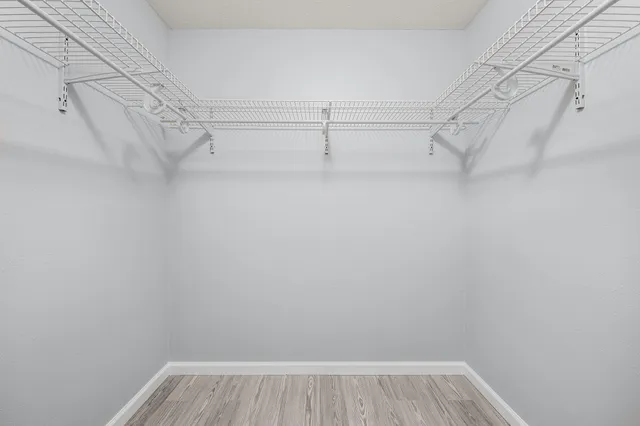 a view of a storage & utility room with closet