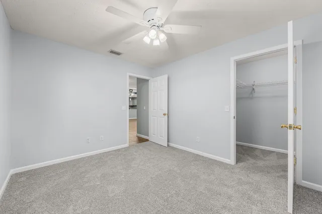 a view of a patio with table and chairs and potted plants