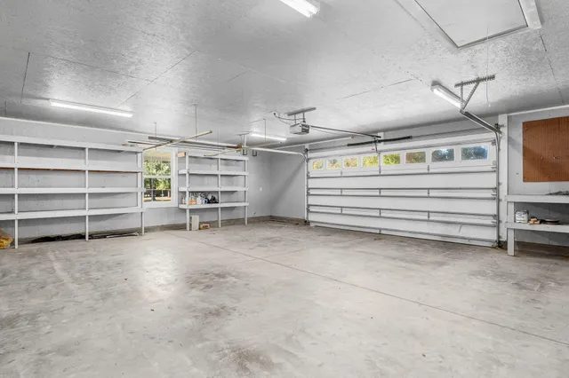 a view of a house with swimming pool and furniture