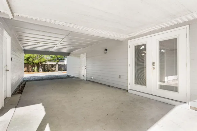 a view of a house with a yard and tree s