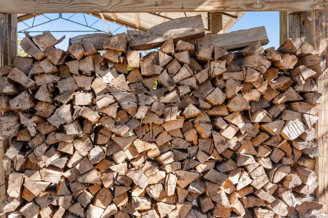 a house view with swimming pool in front of it