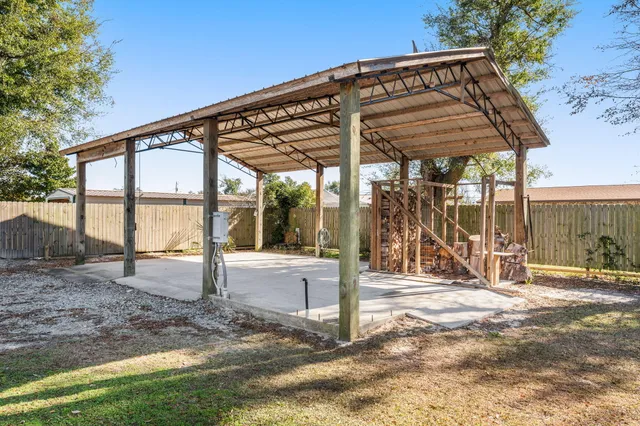 a view of a swimming pool with an outdoor space and seating area