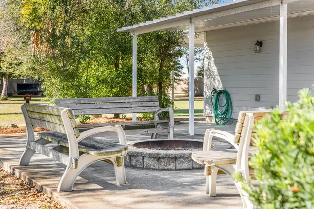 an aerial view of a house with yard swimming pool and mountain view