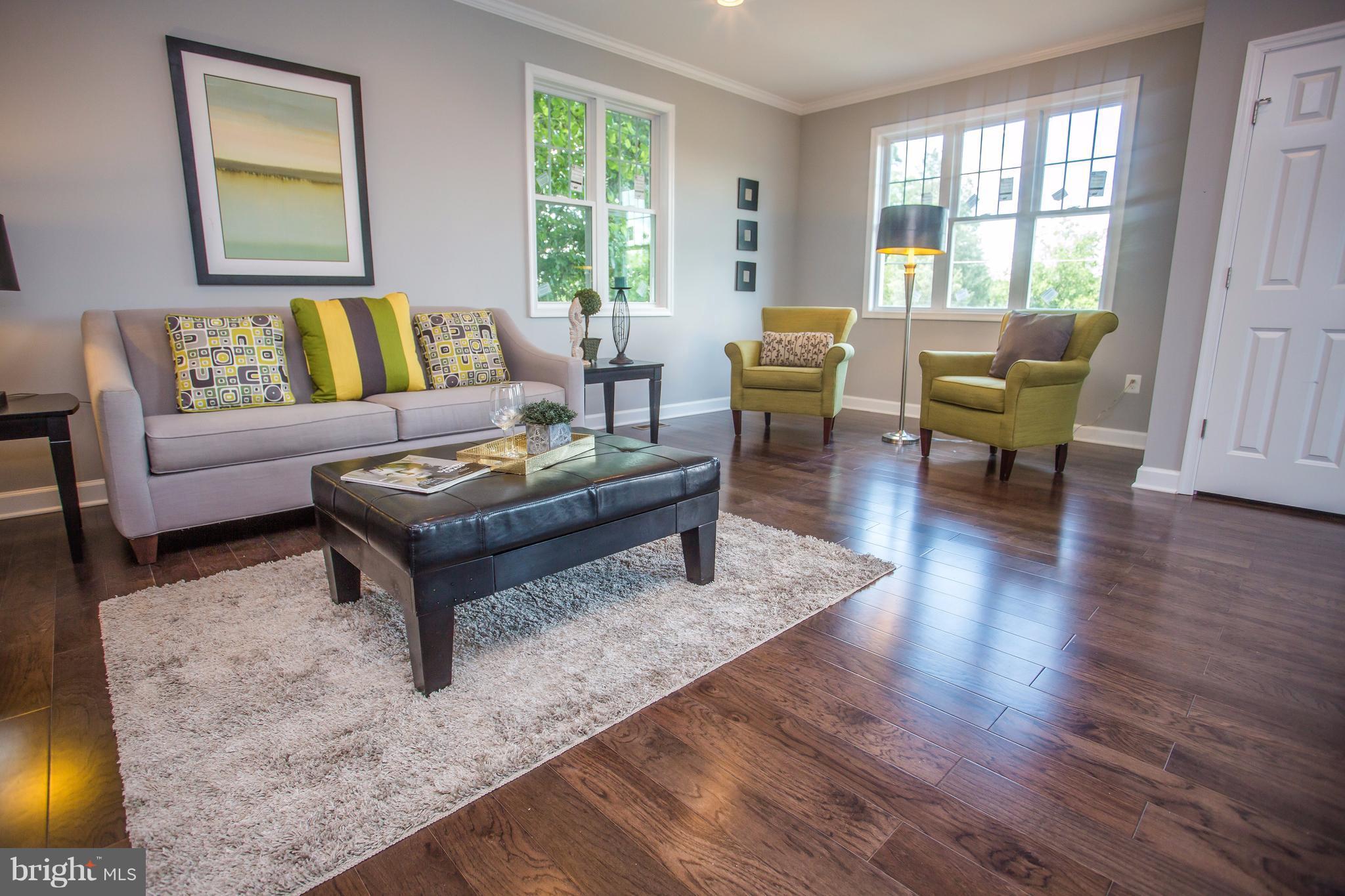 6445 First Street Alexandria, VA 22312 - Photo 2 of 28 a living room with furniture and a large window with wooden floor