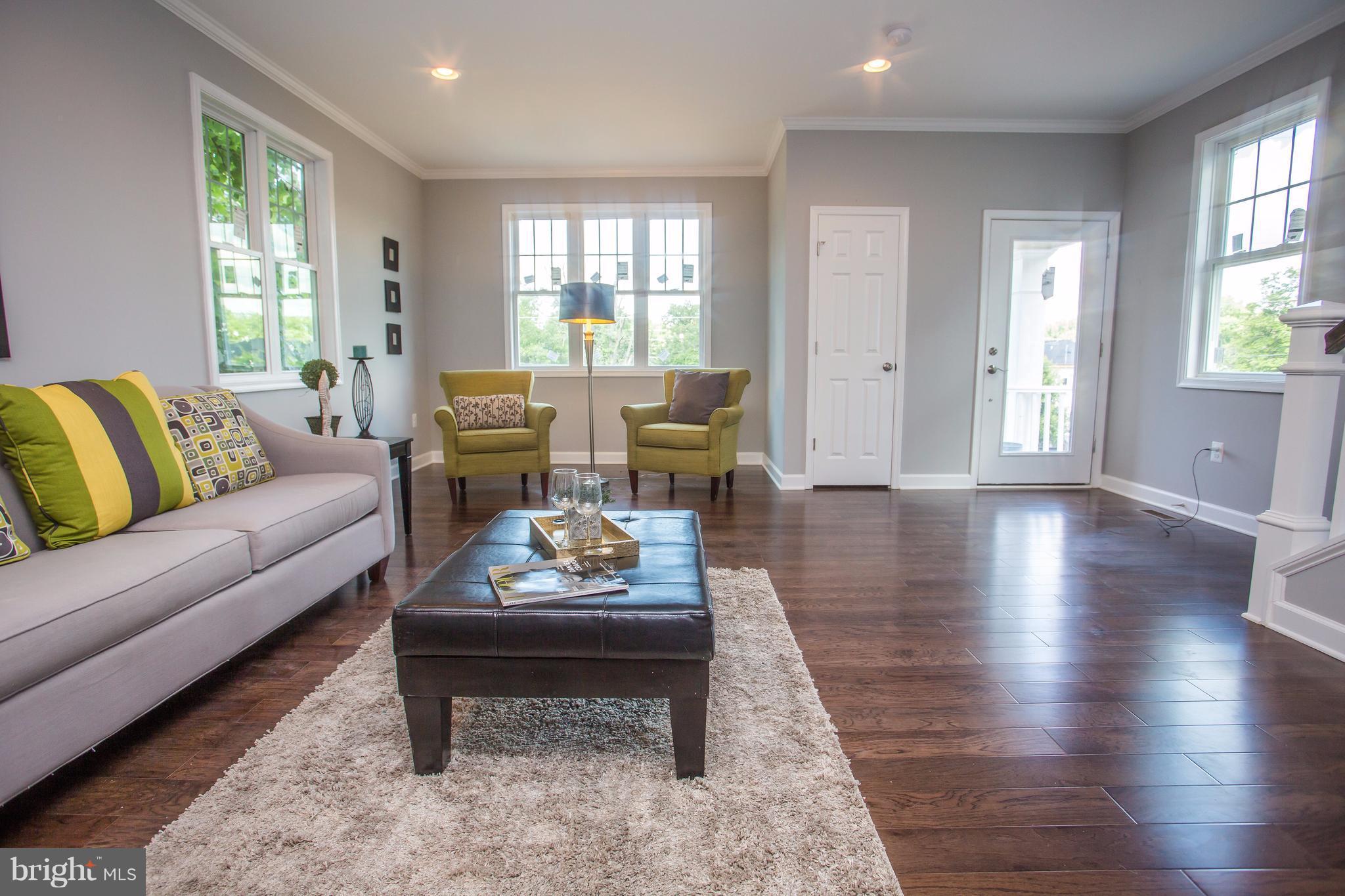 6445 First Street Alexandria, VA 22312 - Photo 9 of 28 a living room with furniture and wooden floor