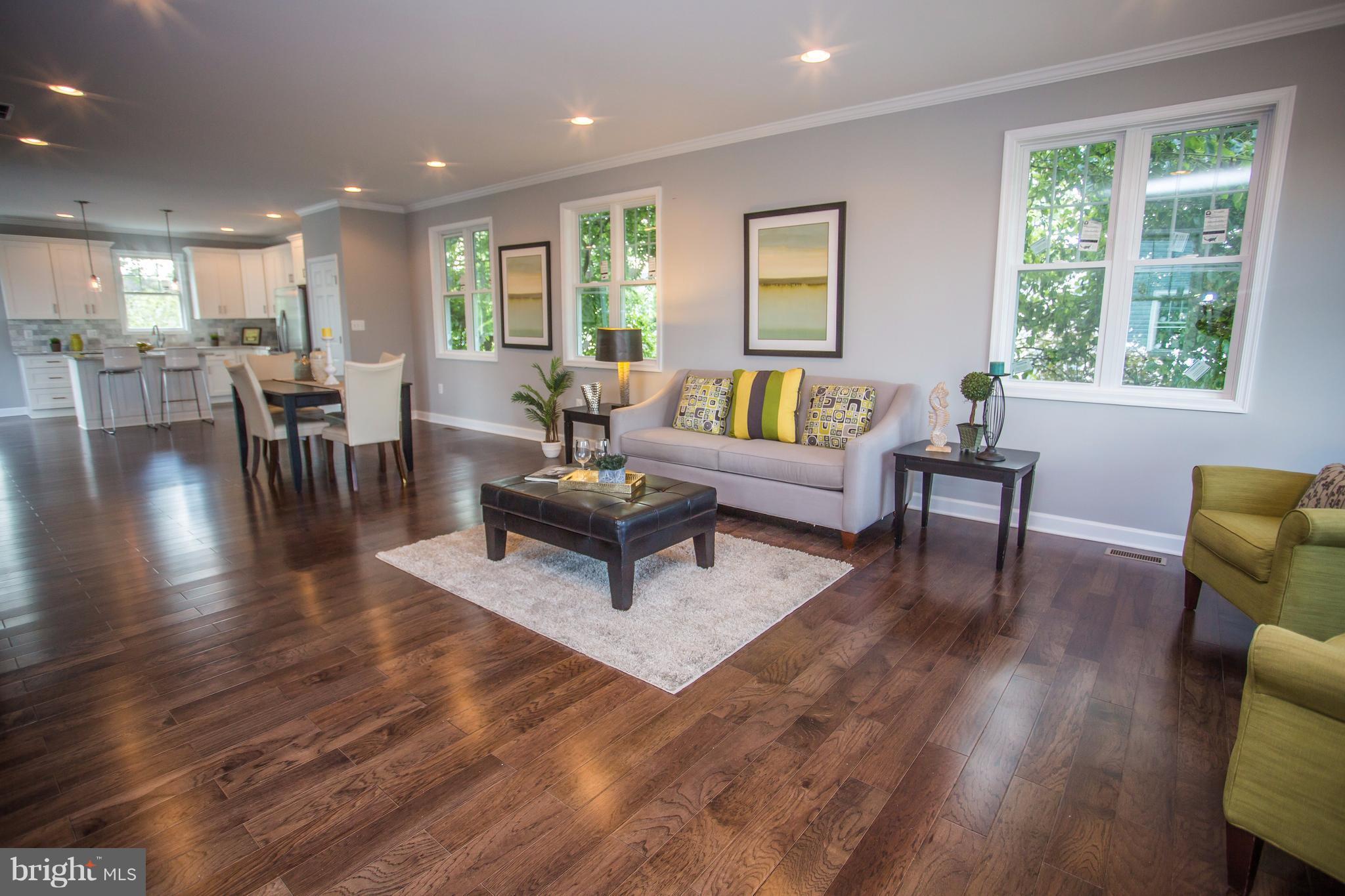 6445 First Street Alexandria, VA 22312 - Photo 10 of 28 a living room with furniture wooden floor and a table