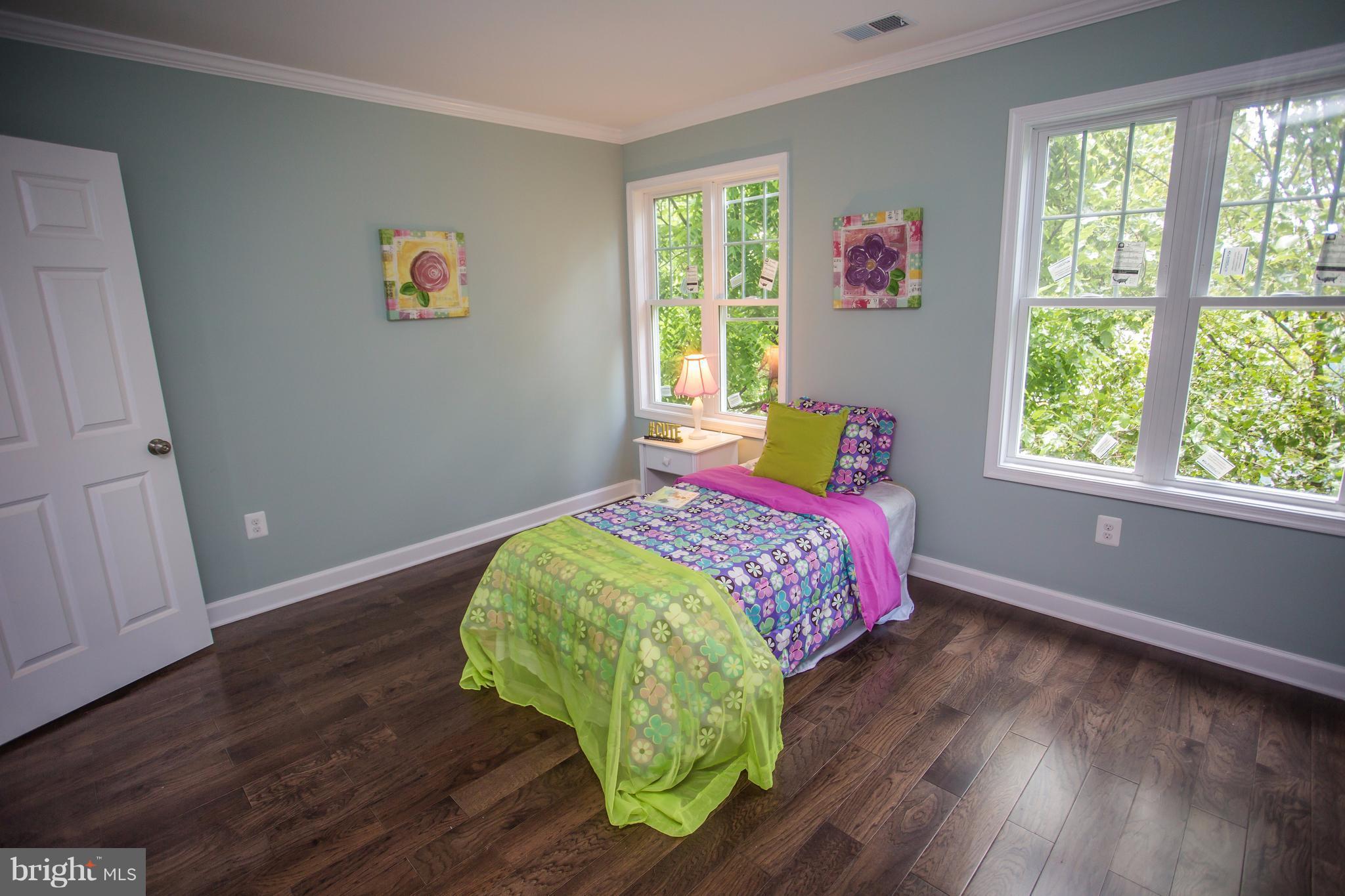6445 First Street Alexandria, VA 22312 - Photo 16 of 28 a bedroom with a bed and a window