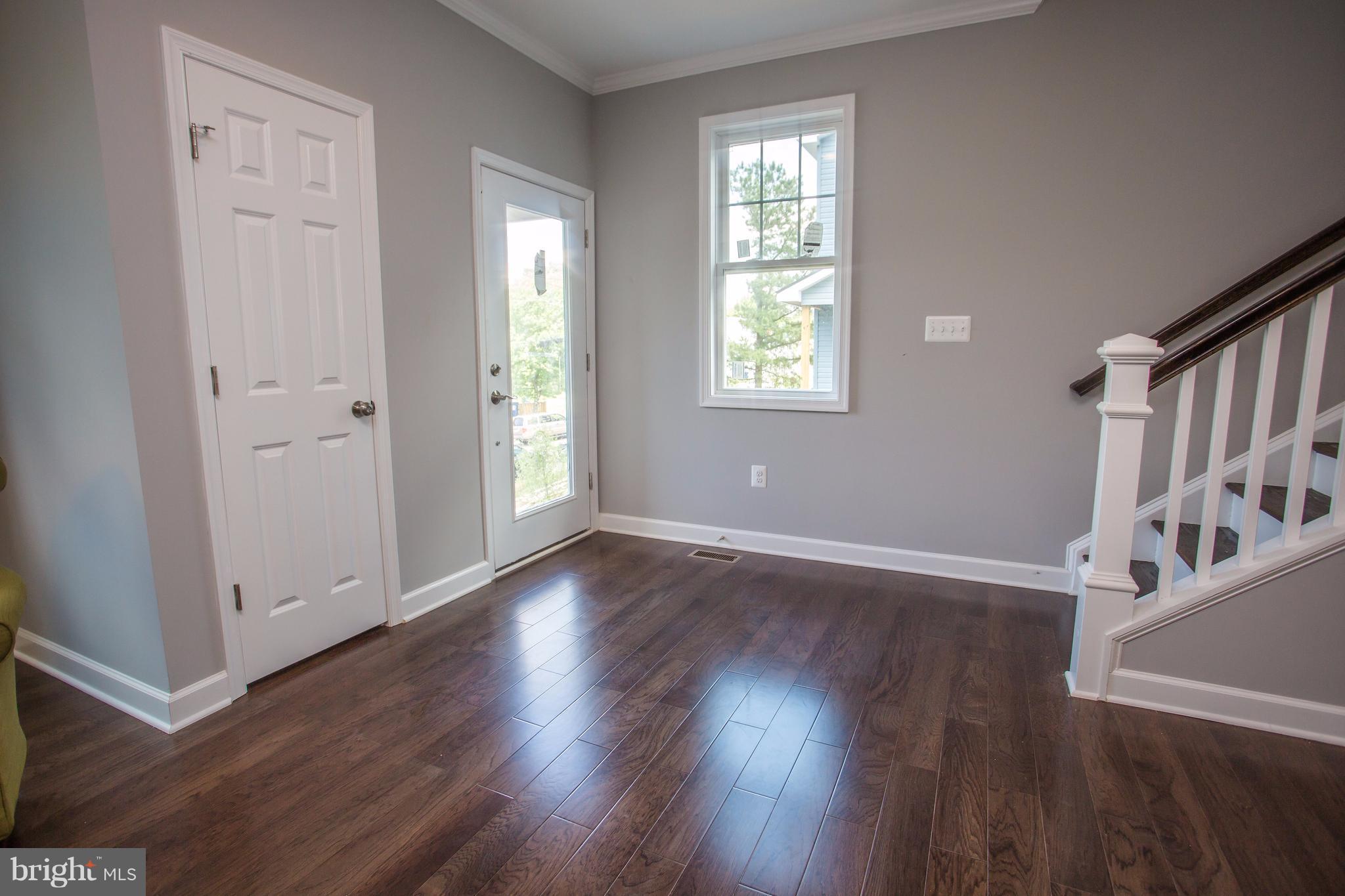 6445 First Street Alexandria, VA 22312 - Photo 23 of 28 an empty room with wooden floor and windows