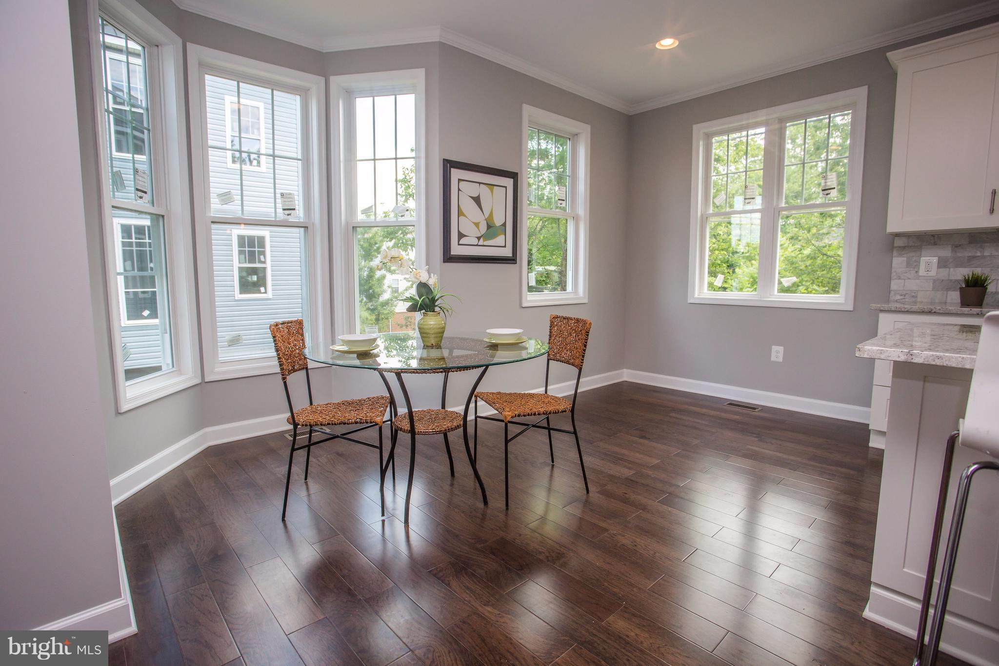 6445 First Street Alexandria, VA 22312 - Photo 7 of 28 a view of a dining room with furniture window and wooden floor
