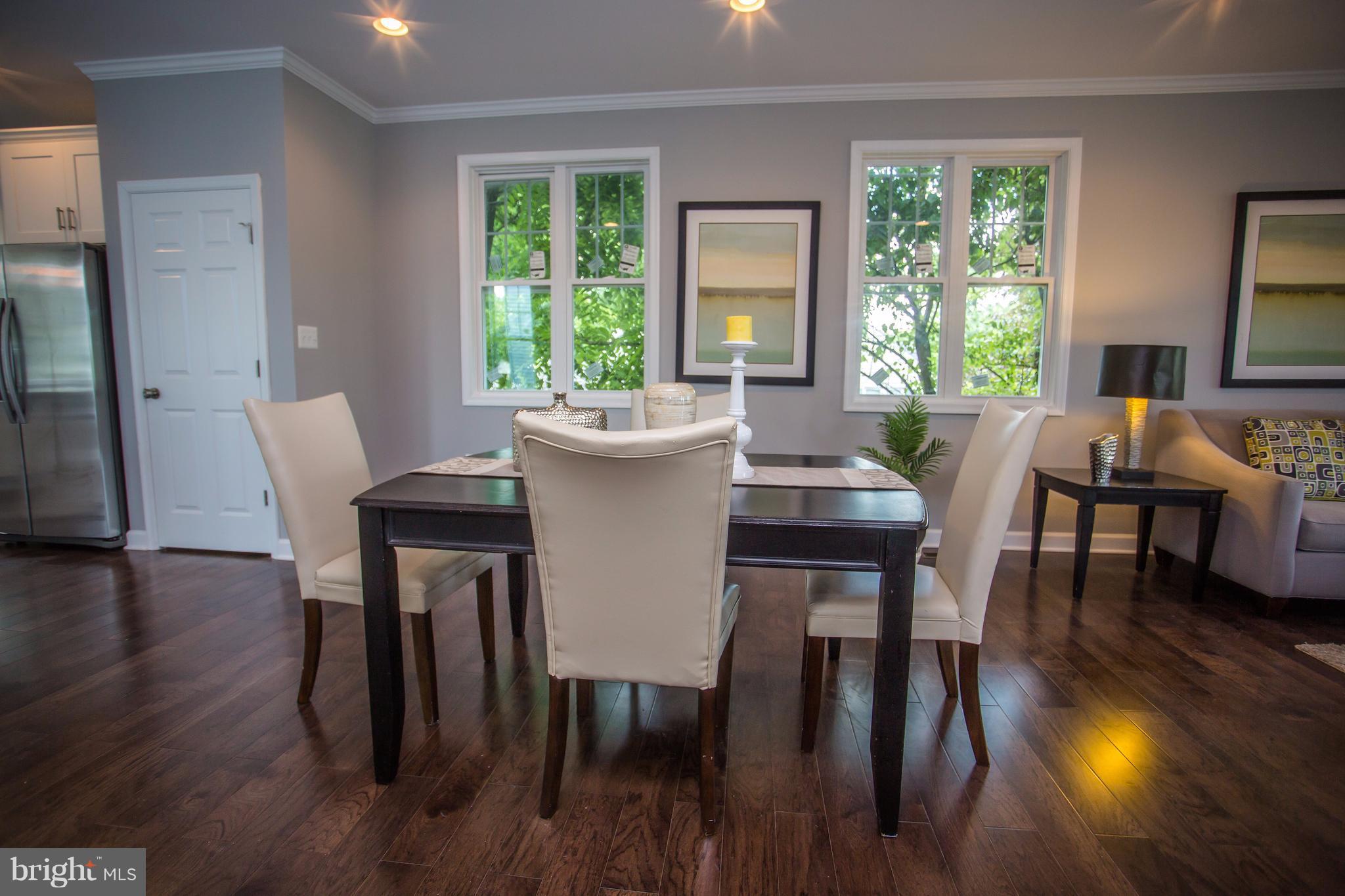 6445 First Street Alexandria, VA 22312 - Photo 8 of 28 a view of a dining room with furniture and wooden floor