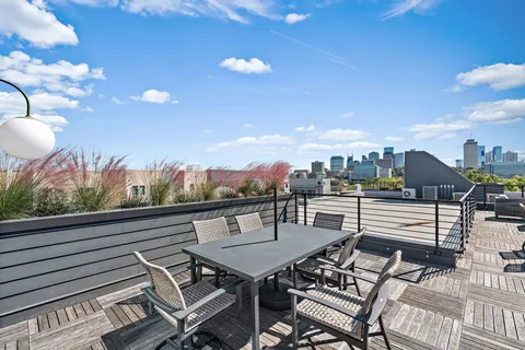 a view of a terrace with furniture and stove
