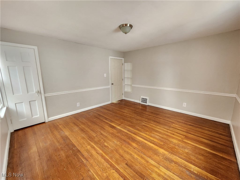 1160 Brentwood Road Cleveland, OH 44121 - Photo 18 of 26 Unfurnished bedroom with hardwood flooring