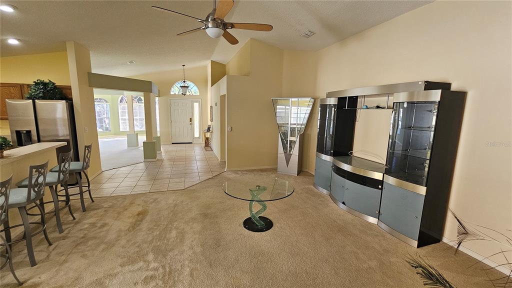 371 Quane Avenue Spring Hill, FL 34609 - Photo 16 of 45 a view of a livingroom with furniture and a ceiling fan