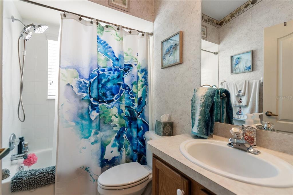 371 Quane Avenue Spring Hill, FL 34609 - Photo 21 of 45 a bathroom with a sink toilet and shower