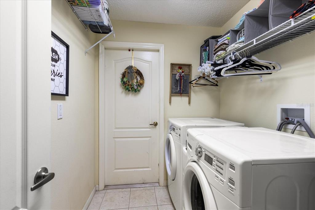 371 Quane Avenue Spring Hill, FL 34609 - Photo 34 of 45 a utility room with dryer and washer