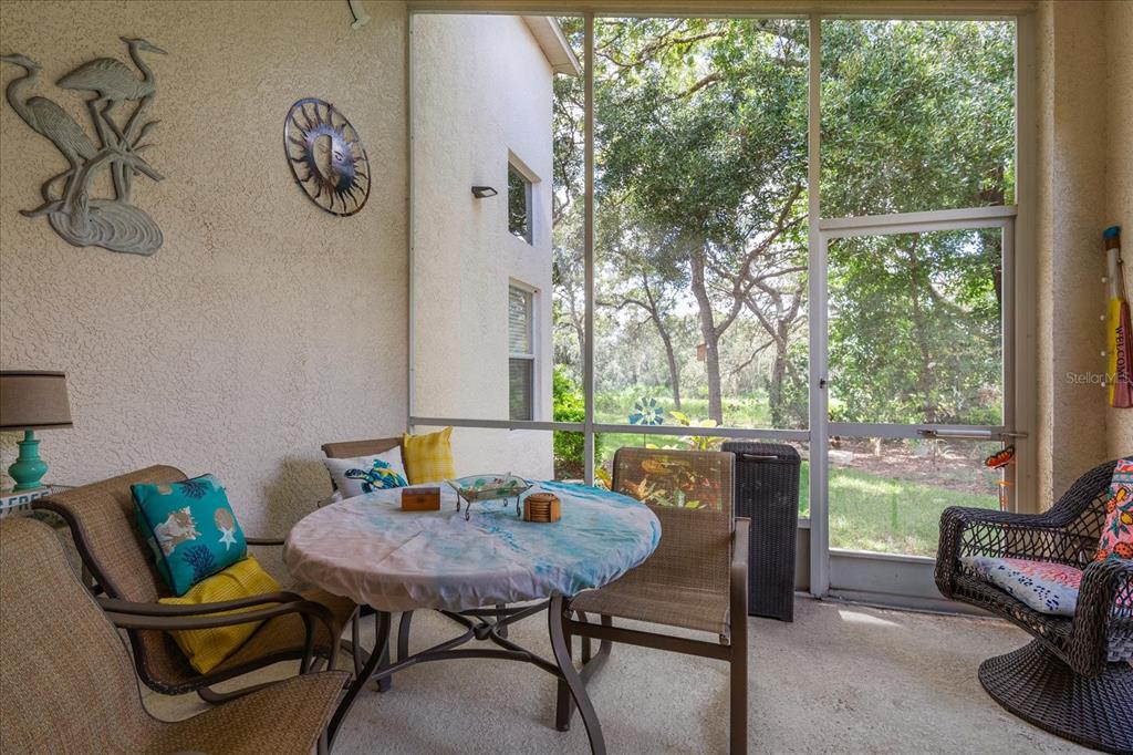 371 Quane Avenue Spring Hill, FL 34609 - Photo 35 of 45 a view of a dining room with furniture window and outside view