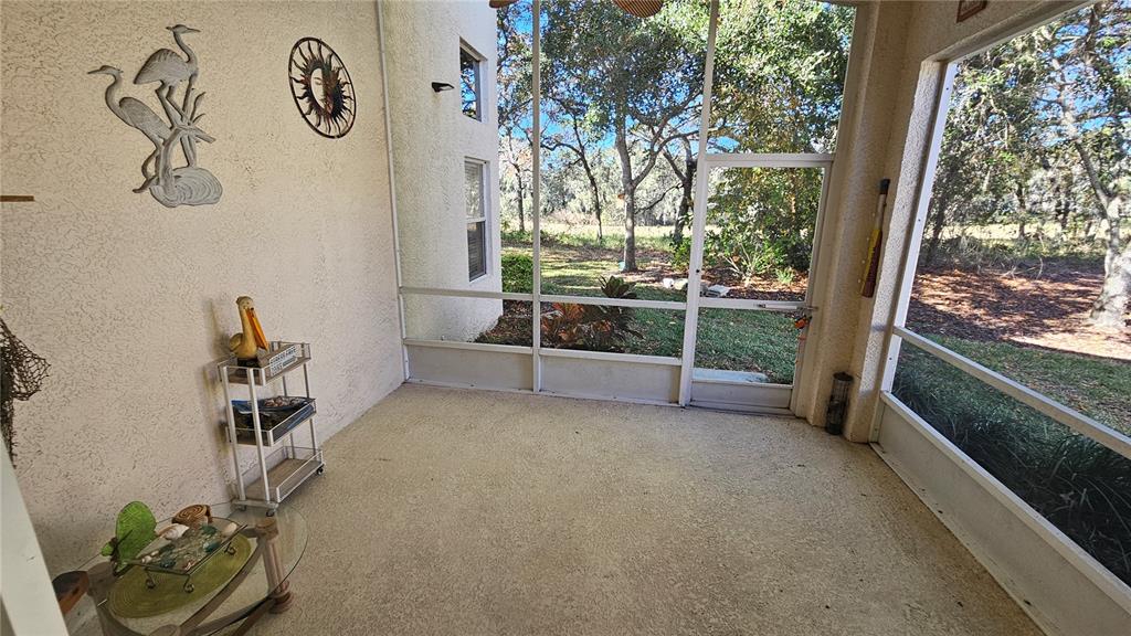 371 Quane Avenue Spring Hill, FL 34609 - Photo 36 of 45 a view of a room with swing hanging chair