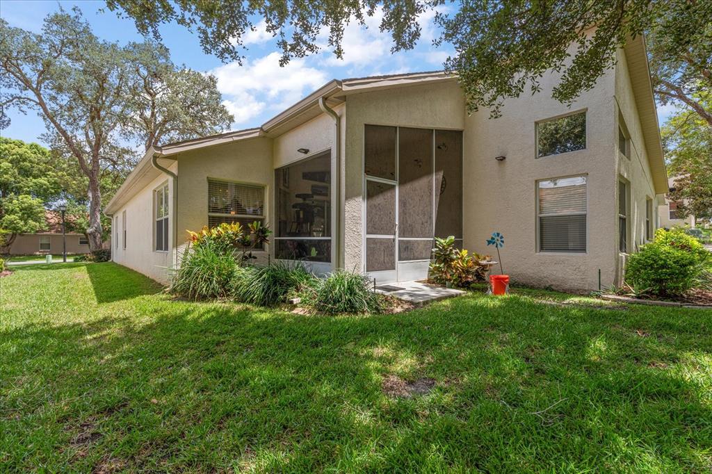 371 Quane Avenue Spring Hill, FL 34609 - Photo 39 of 45 front view of a house with a yard