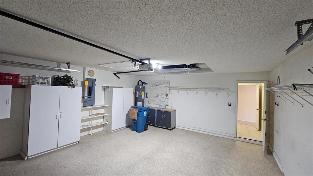 371 Quane Avenue Spring Hill, FL 34609 - Photo 42 of 45 a view of storage and utility room with refrigerator and cabinet