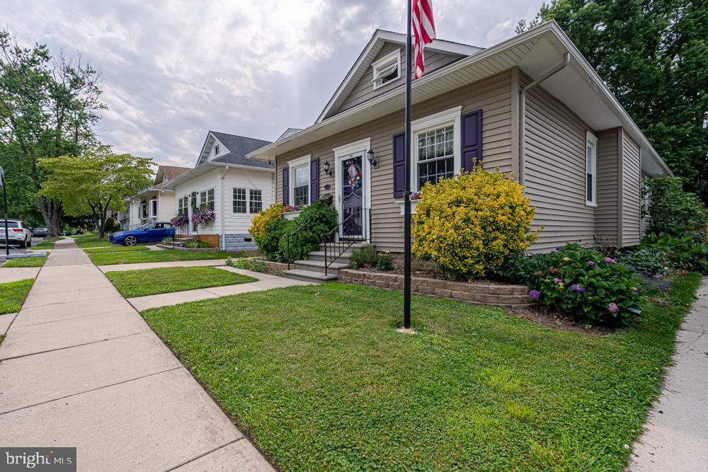 159 Yale Road Audubon, NJ 08106 - Photo 2 of 36 Custom landscaping with Telescopic -Solar Flagpole