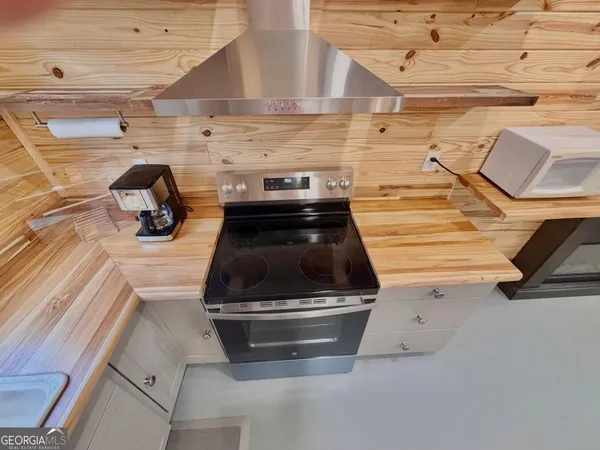 a bedroom with a bed and a ceiling fan