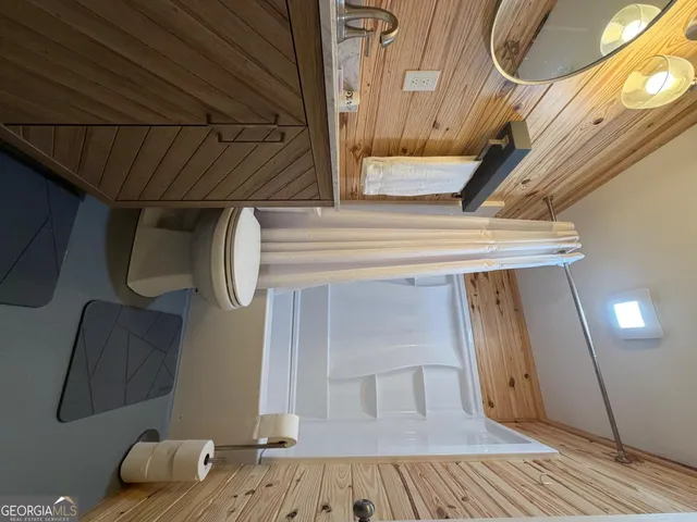 a bathroom with a shower and a bathtub