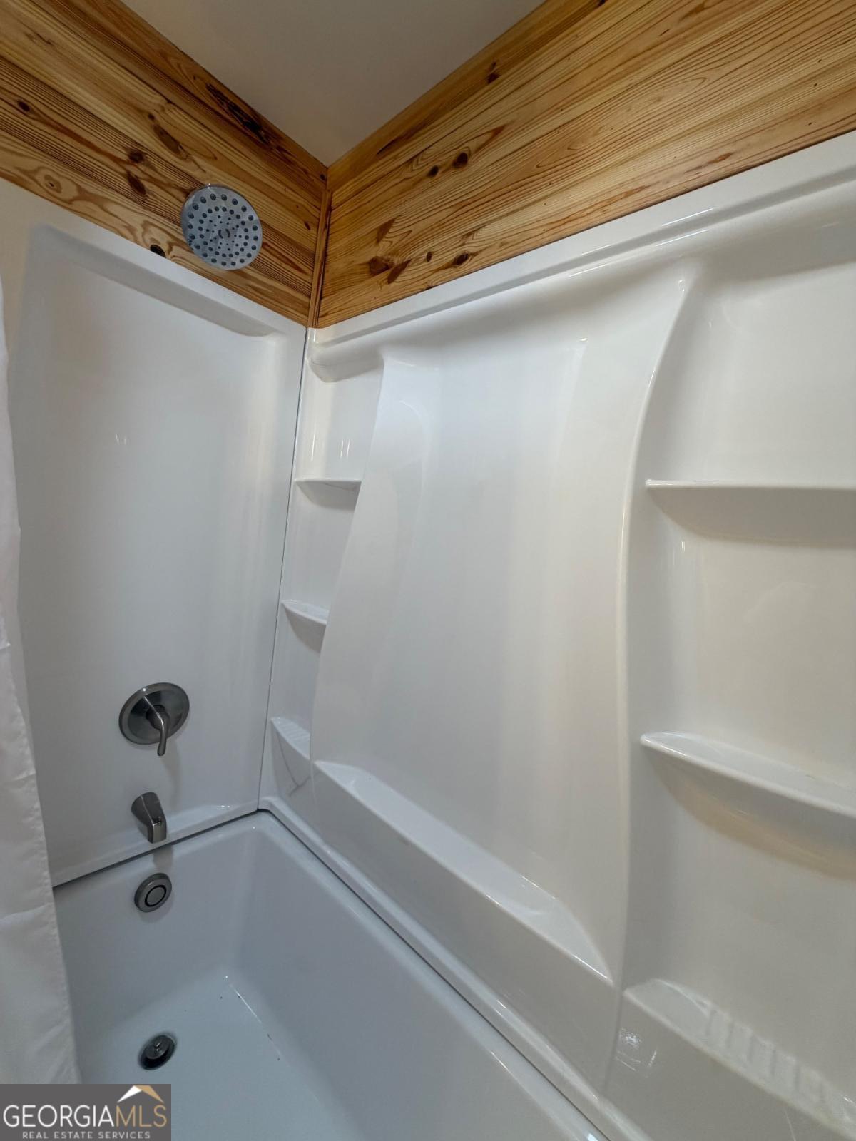 111 Dead River Road Glenwood, GA 30428 - Photo 23 of 40 a bathroom with a shower and a bathtub