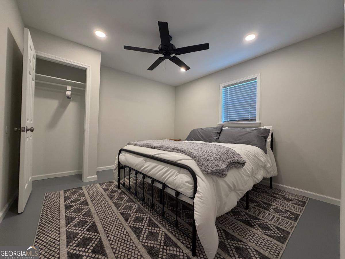 111 Dead River Road Glenwood, GA 30428 - Photo 24 of 40 a bedroom with a bed and a rug