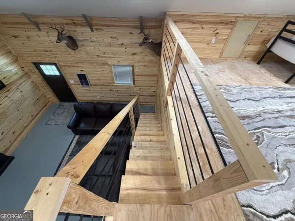 a spacious bedroom with a bed and a couch