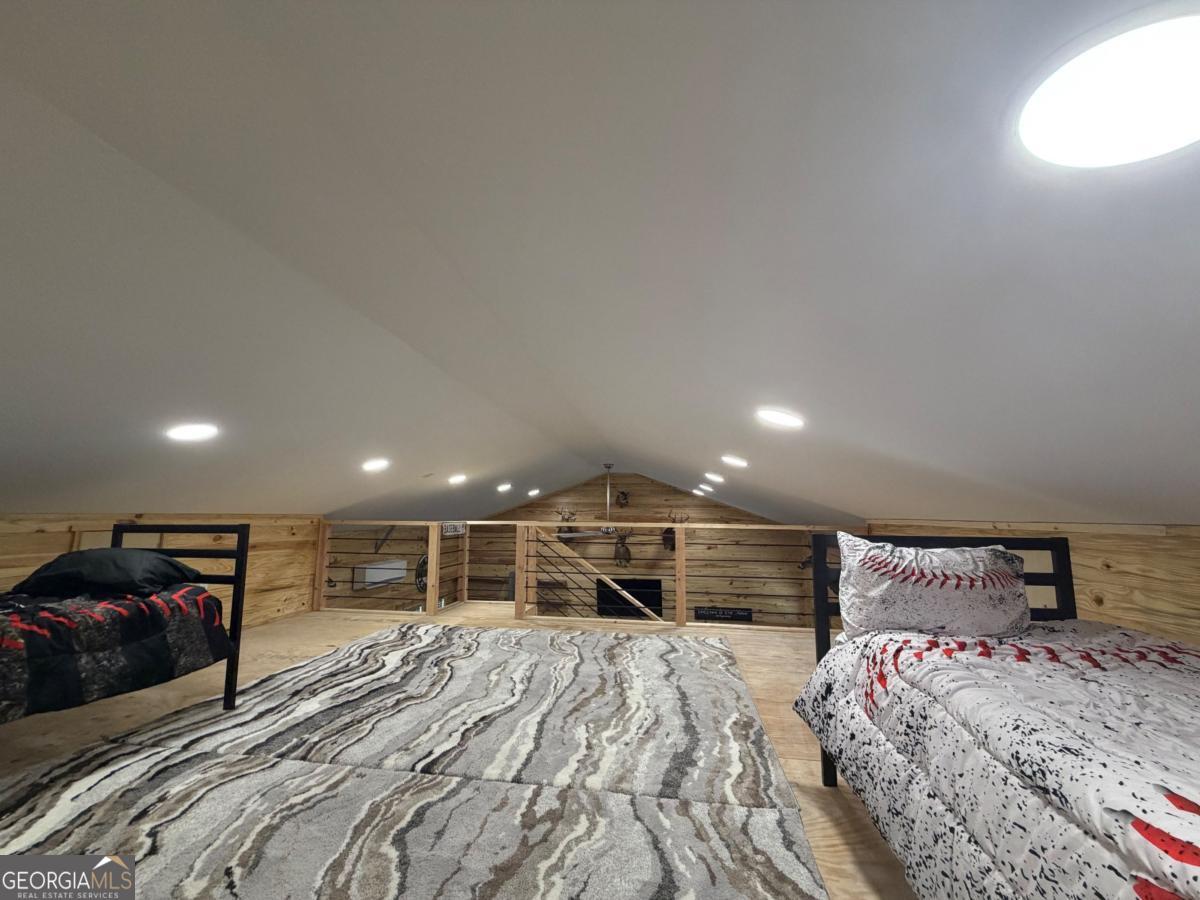 111 Dead River Road Glenwood, GA 30428 - Photo 31 of 39 a bedroom with a bed and a large window