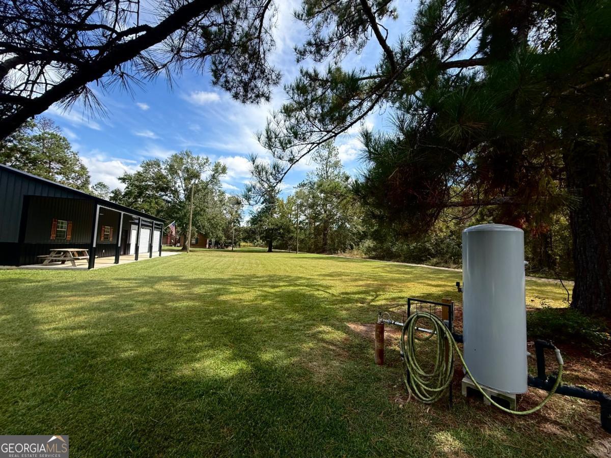 111 Dead River Road Glenwood, GA 30428 - Photo 38 of 39 a view of a house with a yard