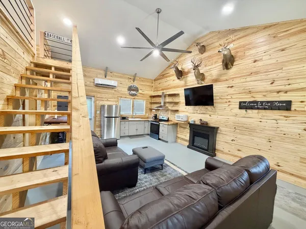 a kitchen with stainless steel appliances a refrigerator and a stove top oven