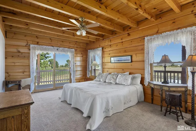 a bedroom with a bed and a table