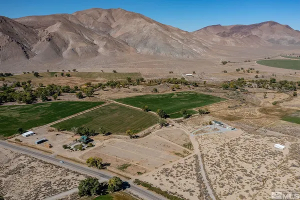 a view of a backyard with mountain view