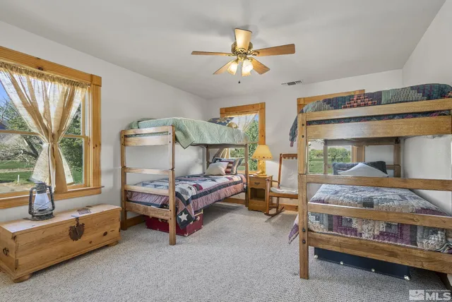 a bedroom with bed and window