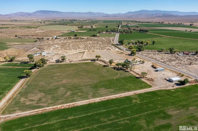 a view of a town with mountains in the background